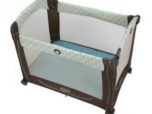 A brown and blue baby crib with wheels